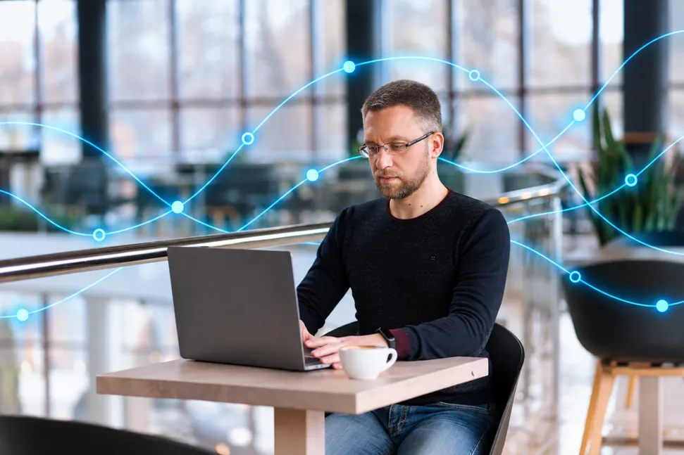A man working at a laptop, with the questions MarketStorm asks drawn around him.
